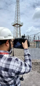 a person using crysound acoustic imager at power generation plant