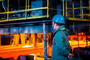 A man checking steel production